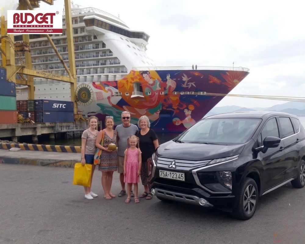 A-family-posing-with-our-black-Mitsubishi-Xpander-at-Chan-May-port