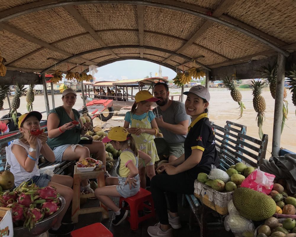 Enjoy-fruits-at-Cai-Be-floating-market