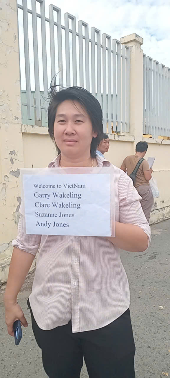 Our driver holds a name board of customers at Chan May port