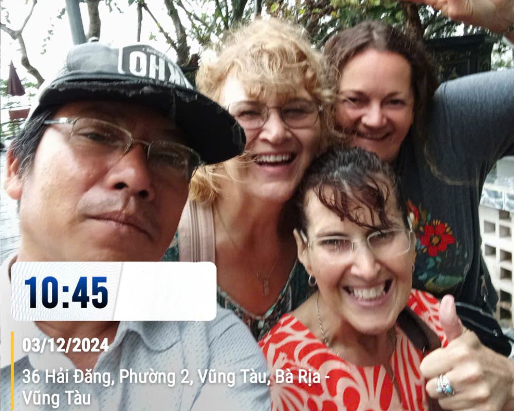 Our driver take a photo with tourists at Vung Tau Lighthouse