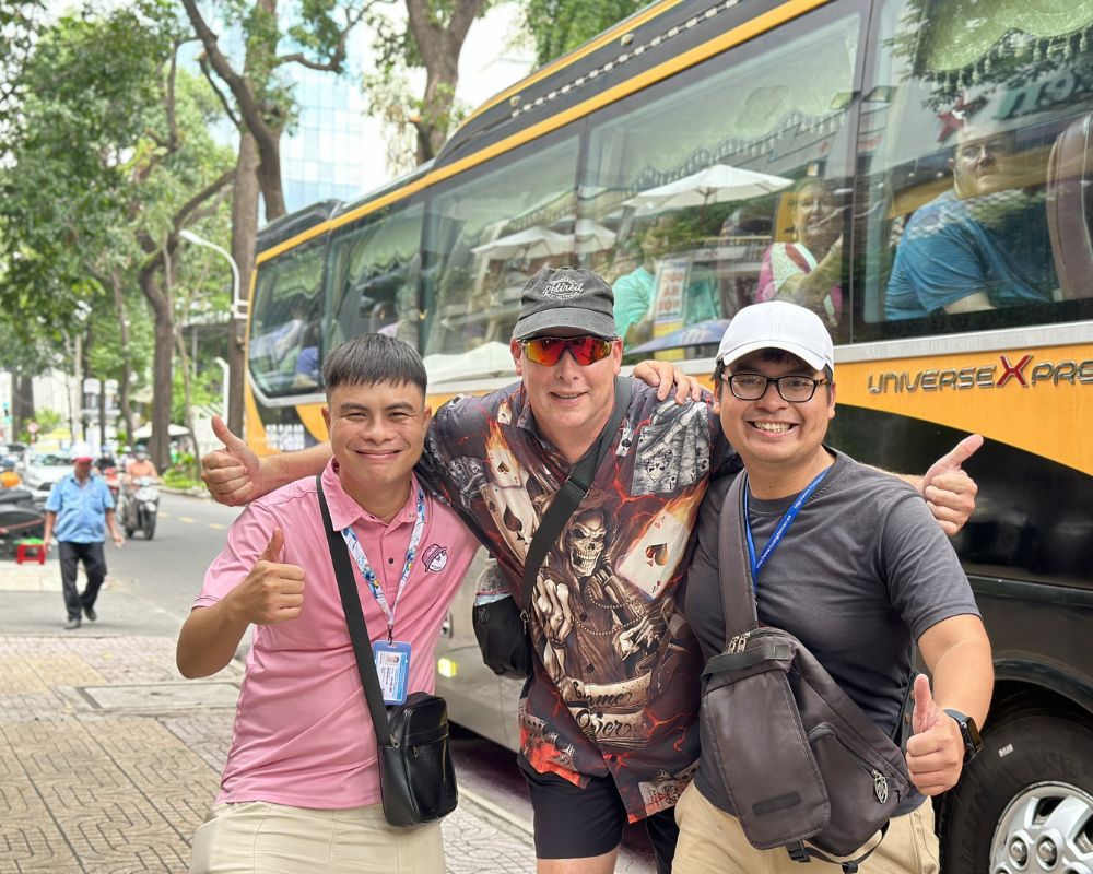 Tourist take a photo with our driver and tour guide