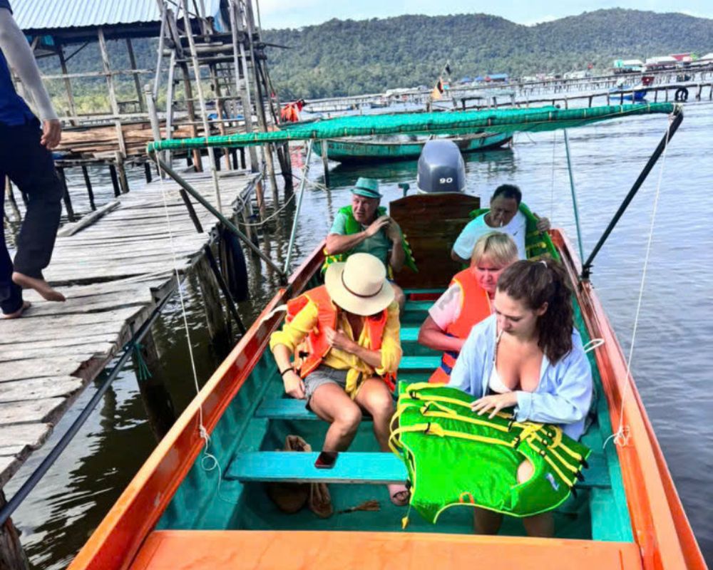 Tourists-are-getting-ready-for-a-boat-trip-at-a-wooden-pier-in-Phu-Quoc-Vietnam