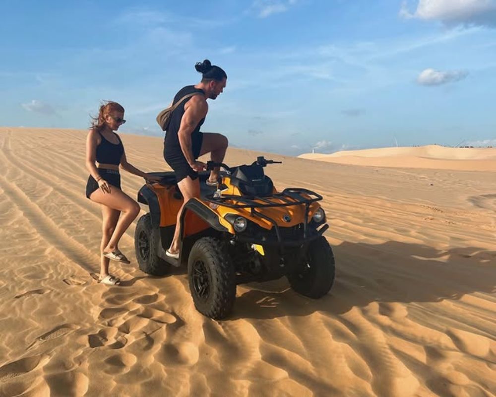 White sand dunes by jeep vehicles
