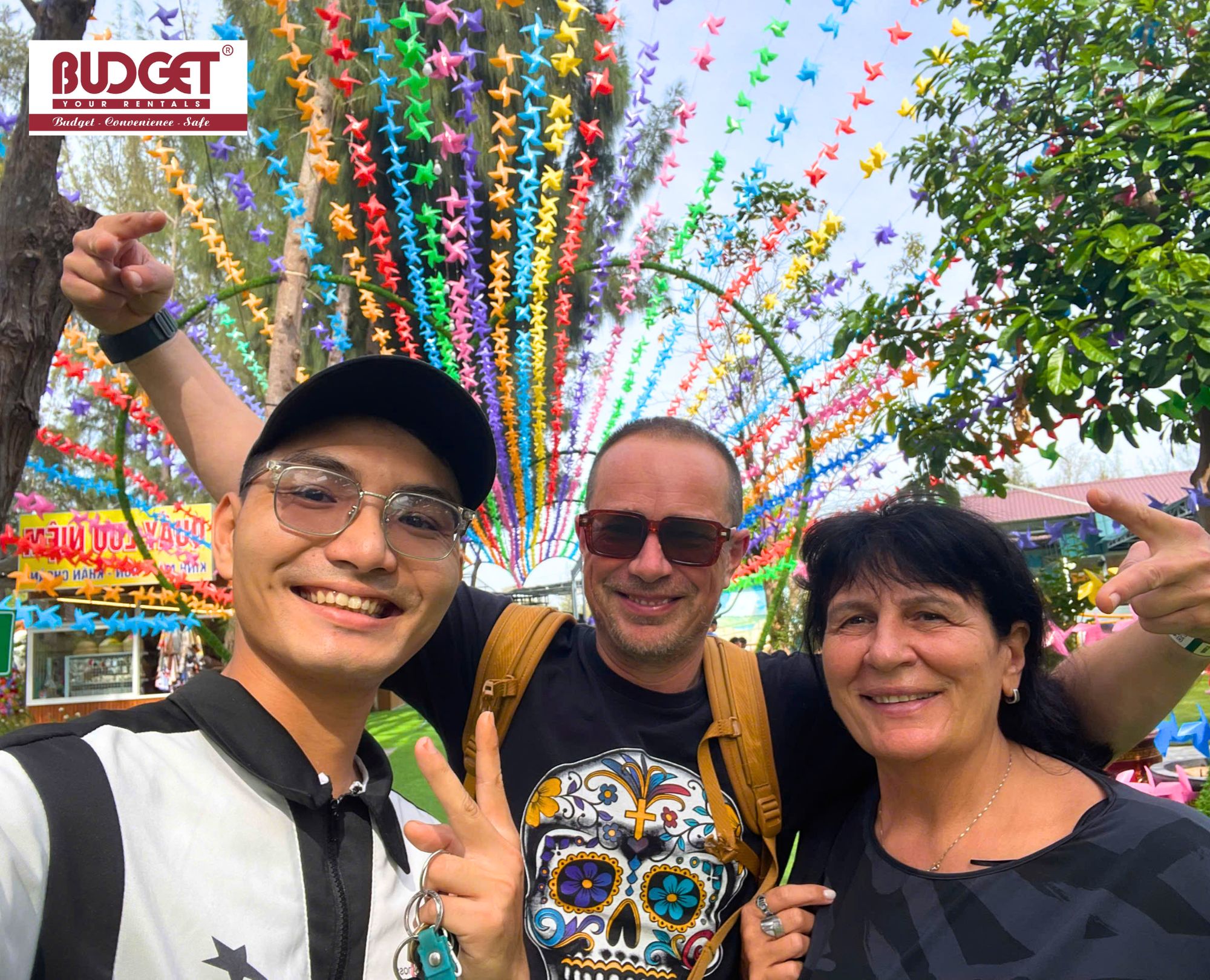 Happy-international-tourists-taking-a-selfie-with-their-friendly-local-driver-during-a-Hanoi-inter-provincial-travel-trip