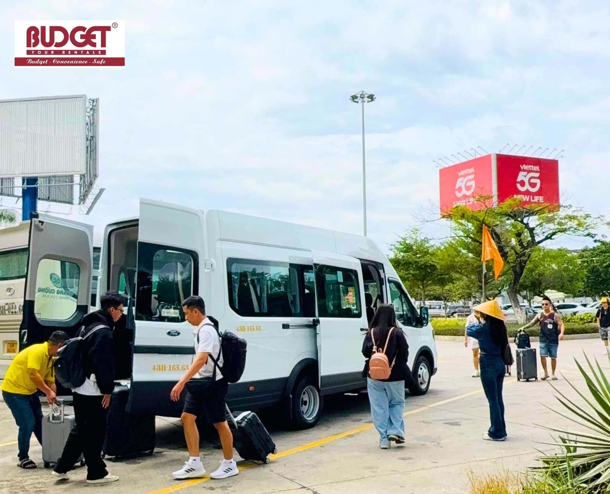Punctual-and-reliable-Hanoi-airport-transfer-showing-a-group-of-passengers-boarding-a-clean-modern-shuttle-van