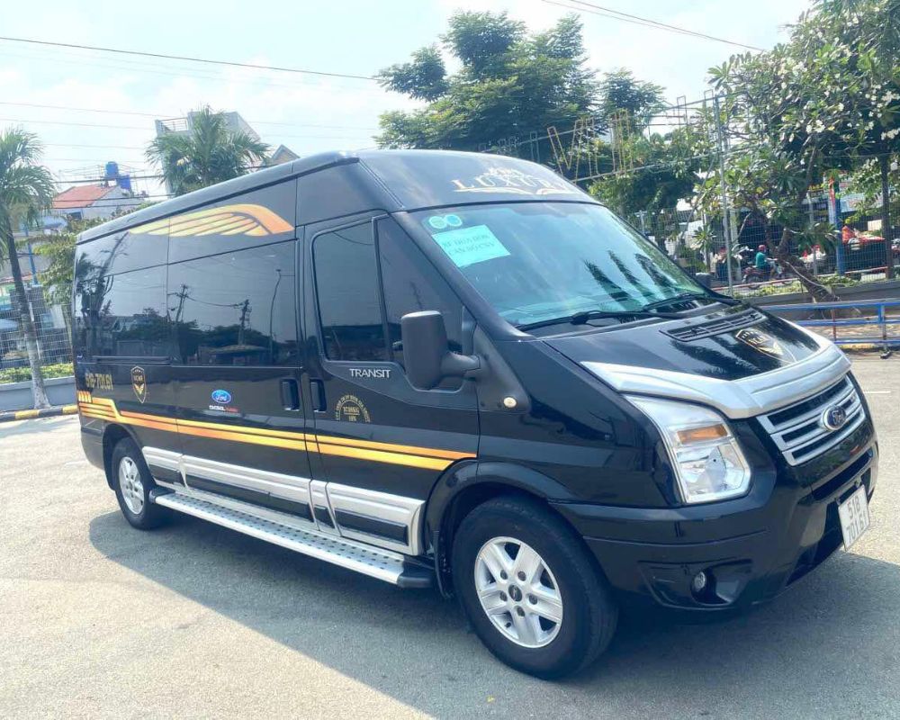 Black Ford Transit limousine van parked outdoors