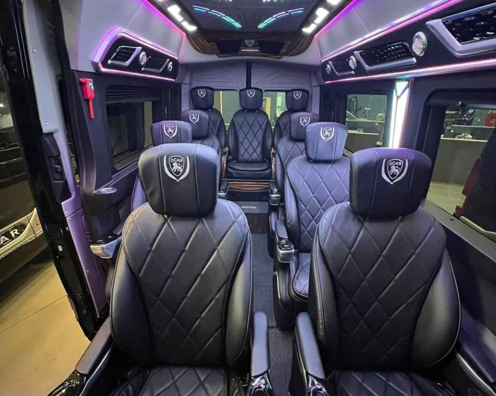 Quilted black leather DCAR chairs inside a high-end limousine van