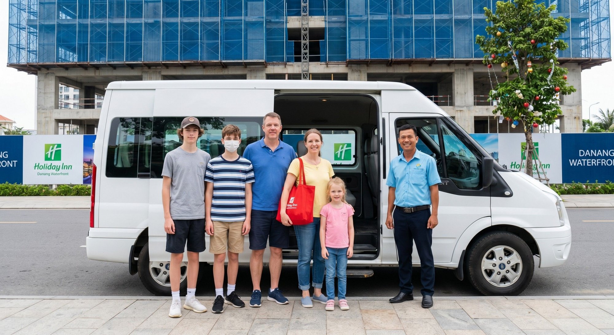 Foreign-family-of-five-and-their-local-driver-posing-next-to-a-white-Ford-Transit-transfer-van-in-Danang