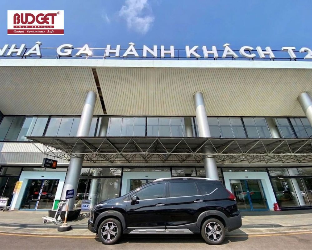 A-black-7-seat-Mitsubishi-Xpander-parked-directly-outside-Passenger-Terminal-2-at-Phu-Cat-airport