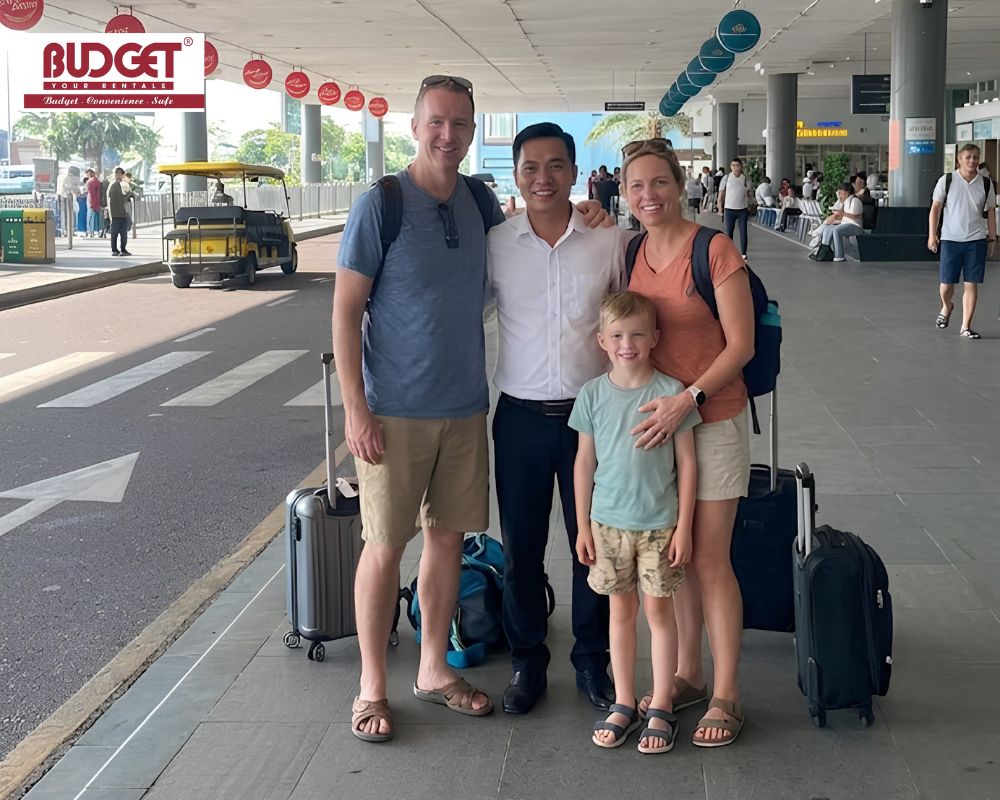 A-happy-foreign-tourist-family-posing-with-their-professional-private-driver-at-Phu-Cat-airport-arrival-terminal