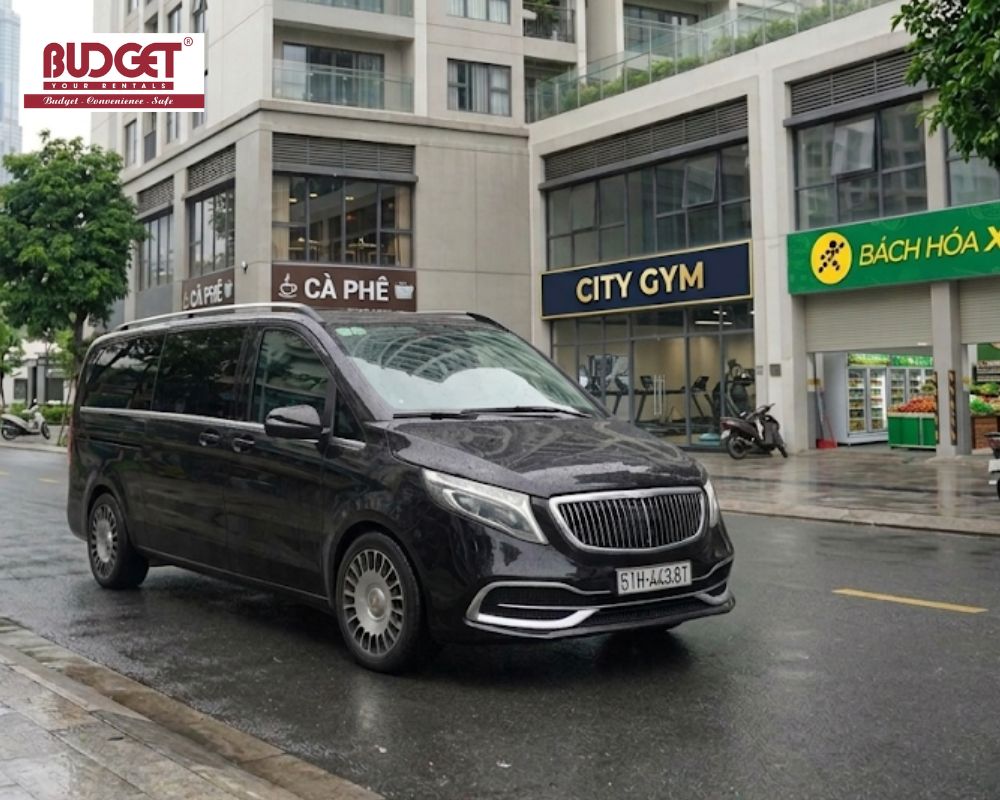 Black-Mercedes-Benz-V250-luxury-minivan-parked-on-a-wet-city-street-in-Ho-Chi-Minh-City