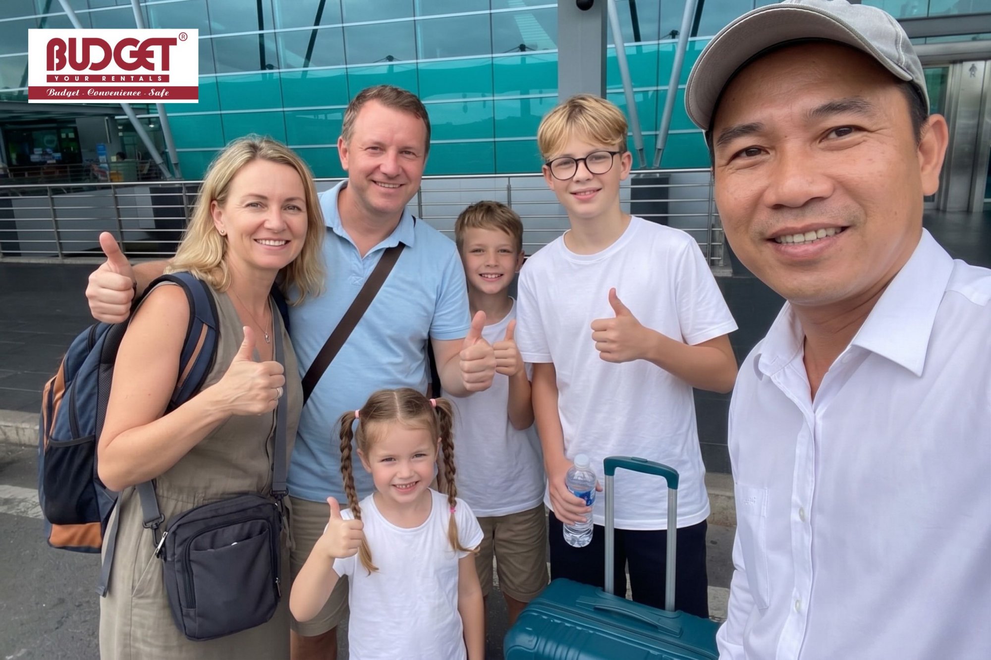 Family-of-foreign-tourists-taking-a-selfie-with-our-local-driver-at-Tan-Son-Nhat-Airport