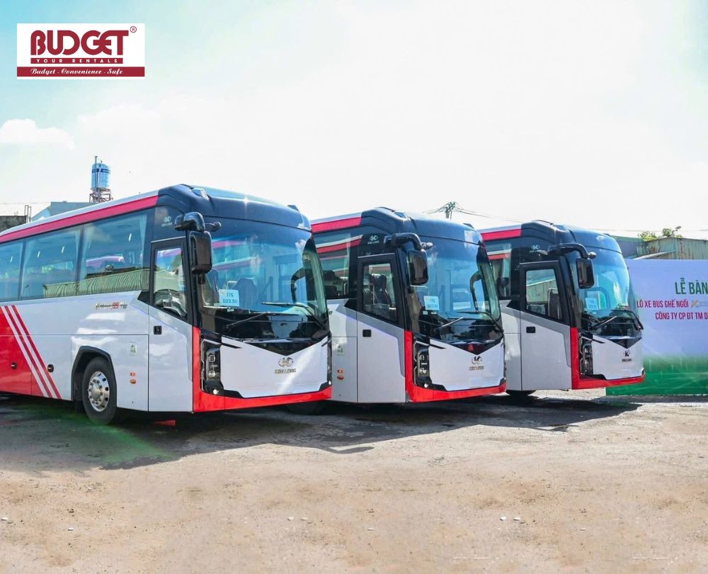 Fleet-of-large-white-and-red-passenger-coaches-lined-up-for-corporate-group-travel-in-Nha-Trang-Vietnam