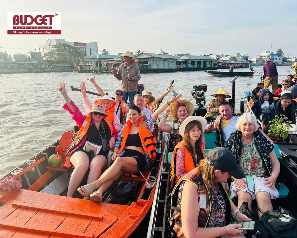 Group-of-foreign-tourists-enjoying-a-lively-boat-tour-at-Cai-Rang-Floating-Market-in-the-Mekong-Delta