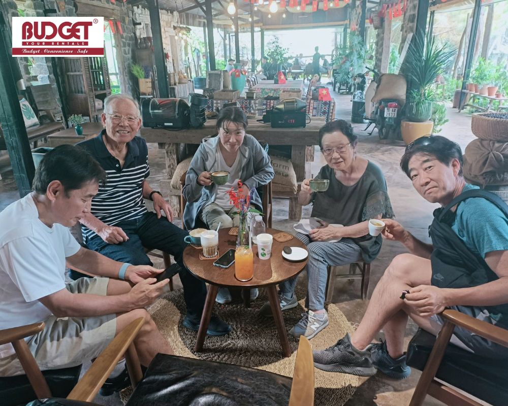 Group-of-international-tourists-enjoying-coffee-during-a-sightseeing-tour-in-Da-Lat