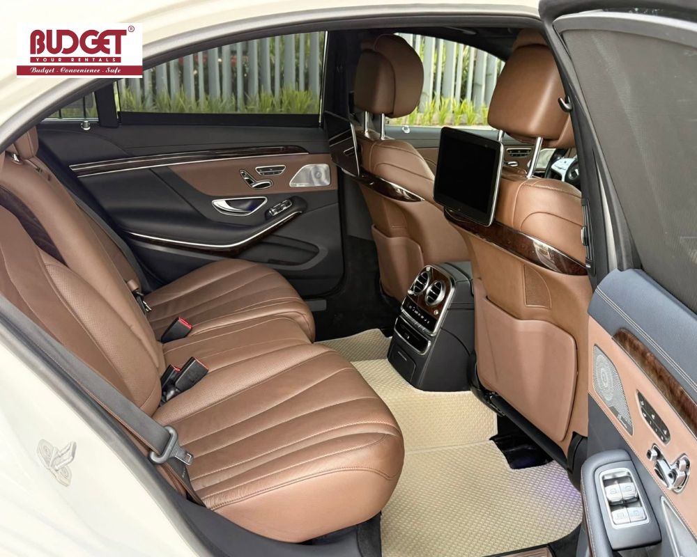 Luxurious-back-seat-interior-of-a-private-car-rental-offering-ultimate-comfort-for-VIP-passengers