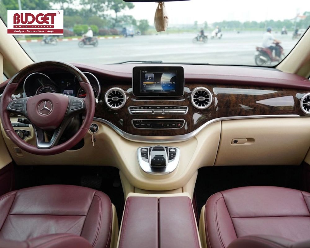Luxurious-front-cabin-interior-of-a-Mercedes-Benz-V-Class-featuring-burgundy-leather-seats