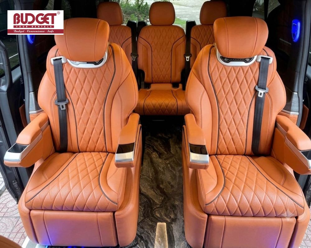 Luxurious-orange-diamond-stitched-leather-captain-seats-inside-our-premium-limousine-van