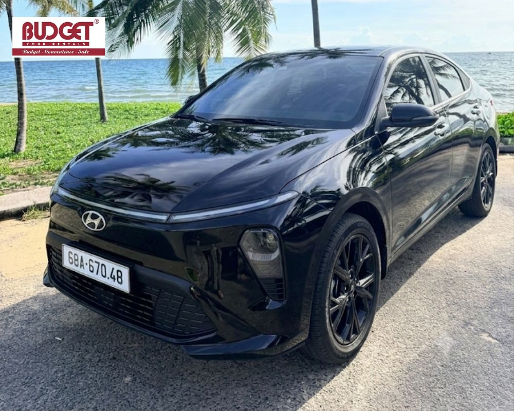 Our-black-4-seat-Hyundai-sedan-parked-by-the-beach-for-a-scenic-coastal-drive-in-Phu-Quoc