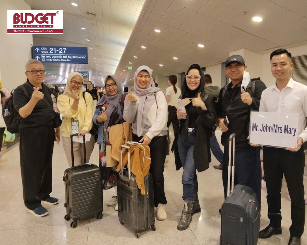Our-driver-holding-a-welcome-sign-for-a-group-of-international-tourists-arriving-at-the-airport
