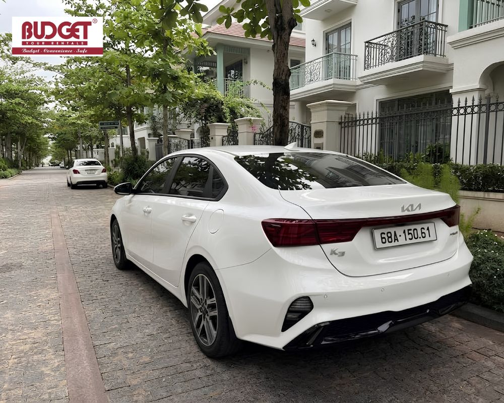 Our-white-4-seat-Kia-K3-sedan-for-private-transportation-inside-a-luxury-villa-complex-in-Phu-Quoc