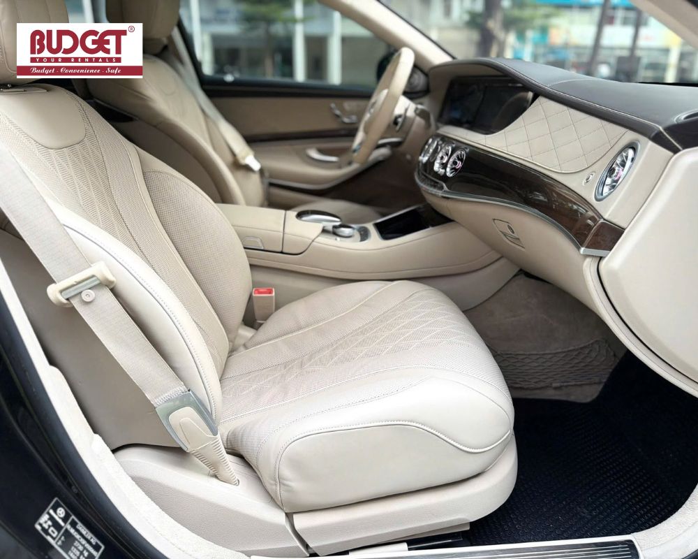 Premium-front-passenger-cabin-of-a-luxury-Mercedes-Benz-S500-rental-car-showing-high-end-wood-trim-and-leather-seats