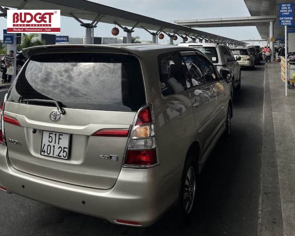 Silver-7-seat-Toyota-Innova-waiting-at-Ho-Chi-Minh-airport-terminal