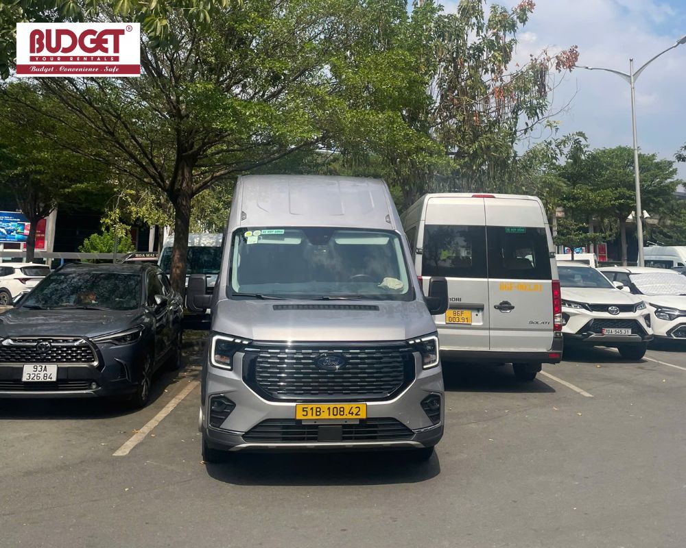 Silver-Ford-Transit-16-seater-passenger-van-for-private-group-transfers-in-Ho-Chi-Minh-City