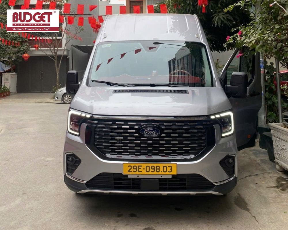 Silver-Ford-Transit-luxury-limousine-van-available-for-private-group-transfers-and-tours-to-Sapa