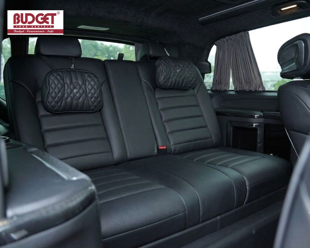 Spacious-black-leather-rear-passenger-seats-with-premium-quilted-headrests-inside-a-luxury-Mercedes-Benz-V-Class-van