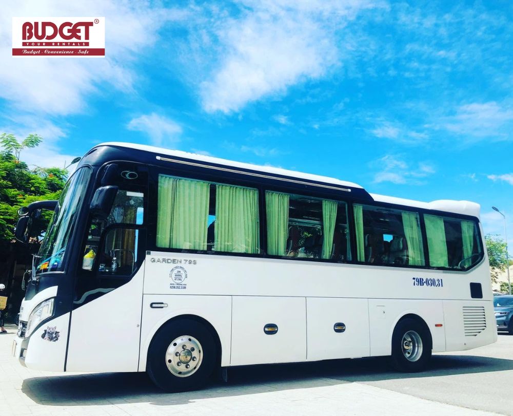 White-29-seater-passenger-bus-parked-outdoors-ready-for-group-tours-in-Nha-Trang