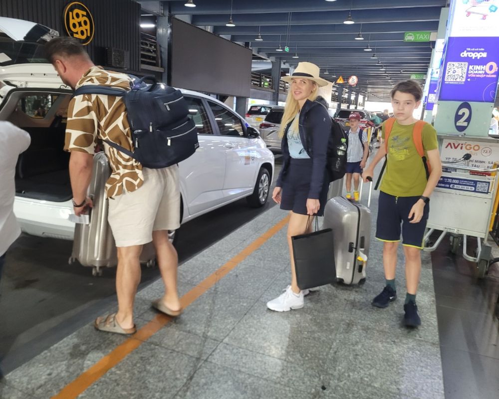 Tourist traveling with luggage in HCM airport