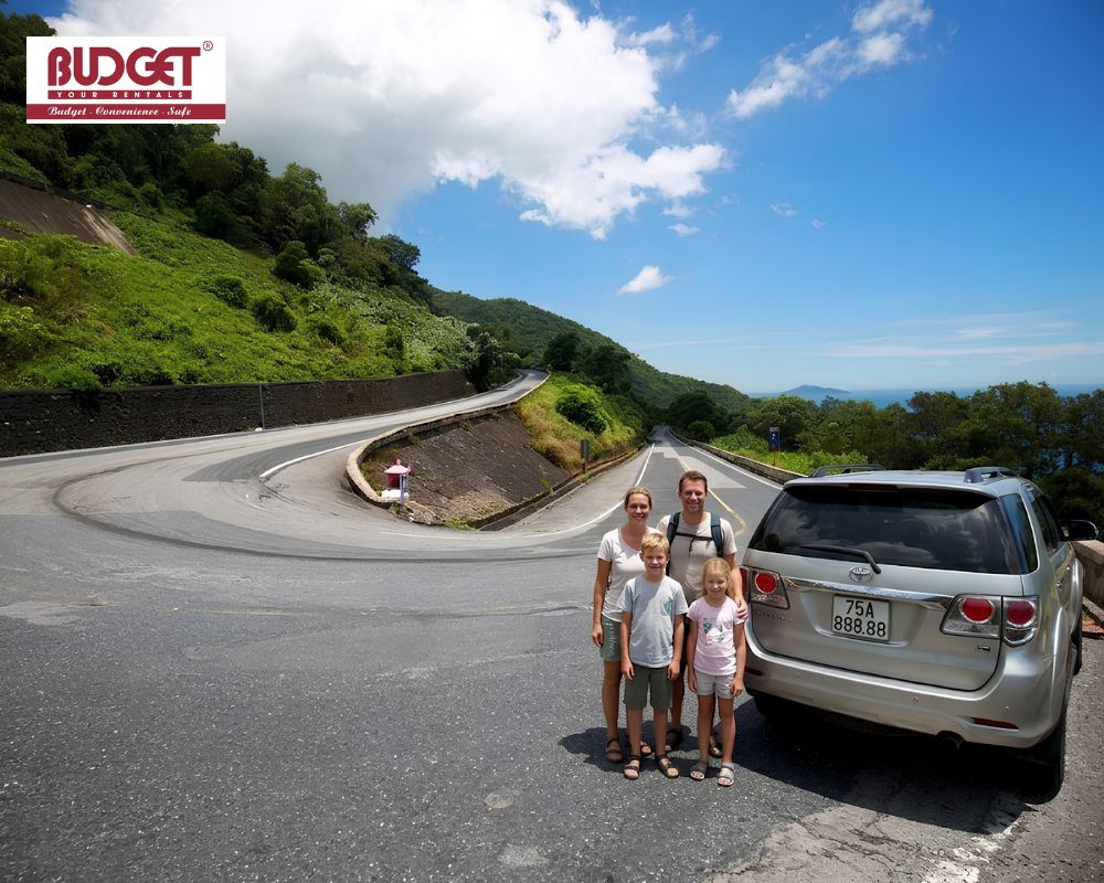 A-British-family-posing-with-our-car-on-Hai-Van-Pass