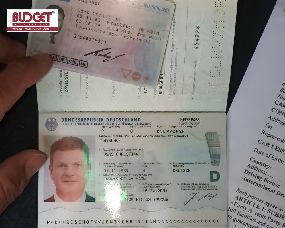 A-German-passport-driver-s-license-and-an-English-car-rental-contract-displayed-together-for-verification