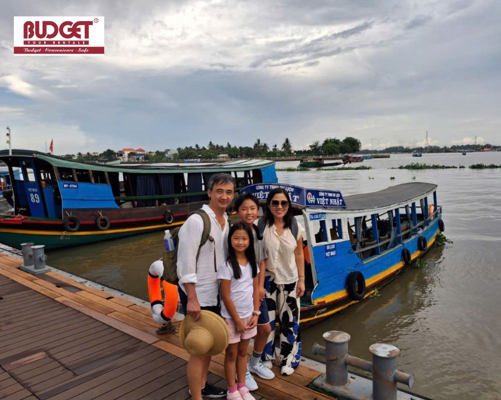 A-family-posing-at-a-river-tourist-pier-in-My-Tho