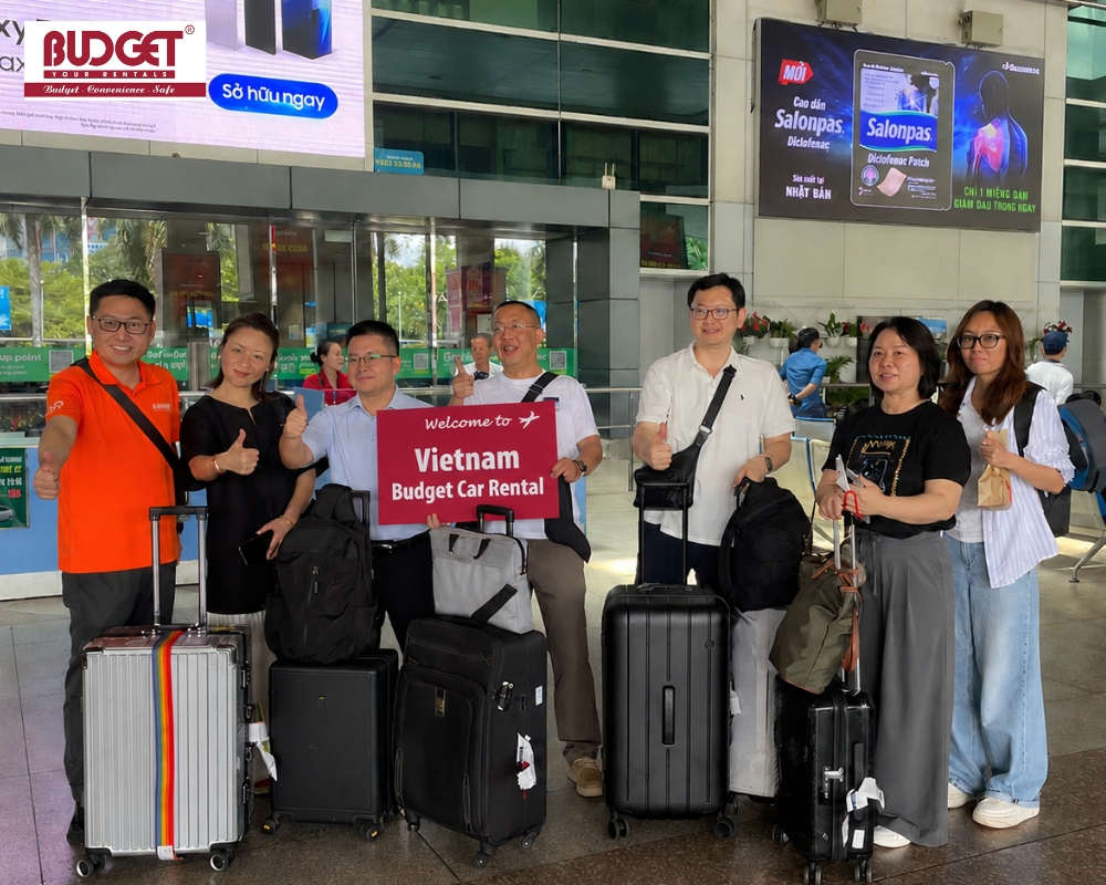 A group of Chinese tourists is welcomed by our driver at Tan Son Nhat International Airport