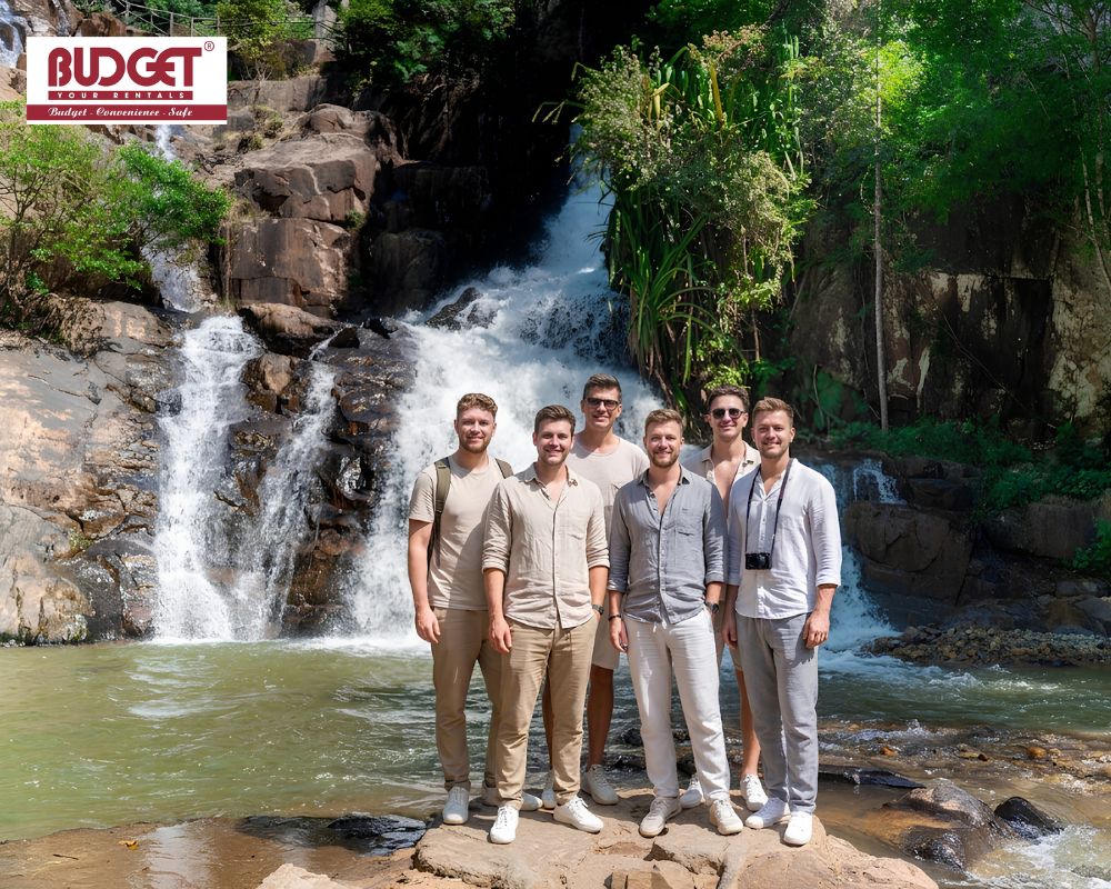 A-group-of-male-travelers-took-a-photo-in-front-of-Datanla-Waterfall-in-Da-Lat