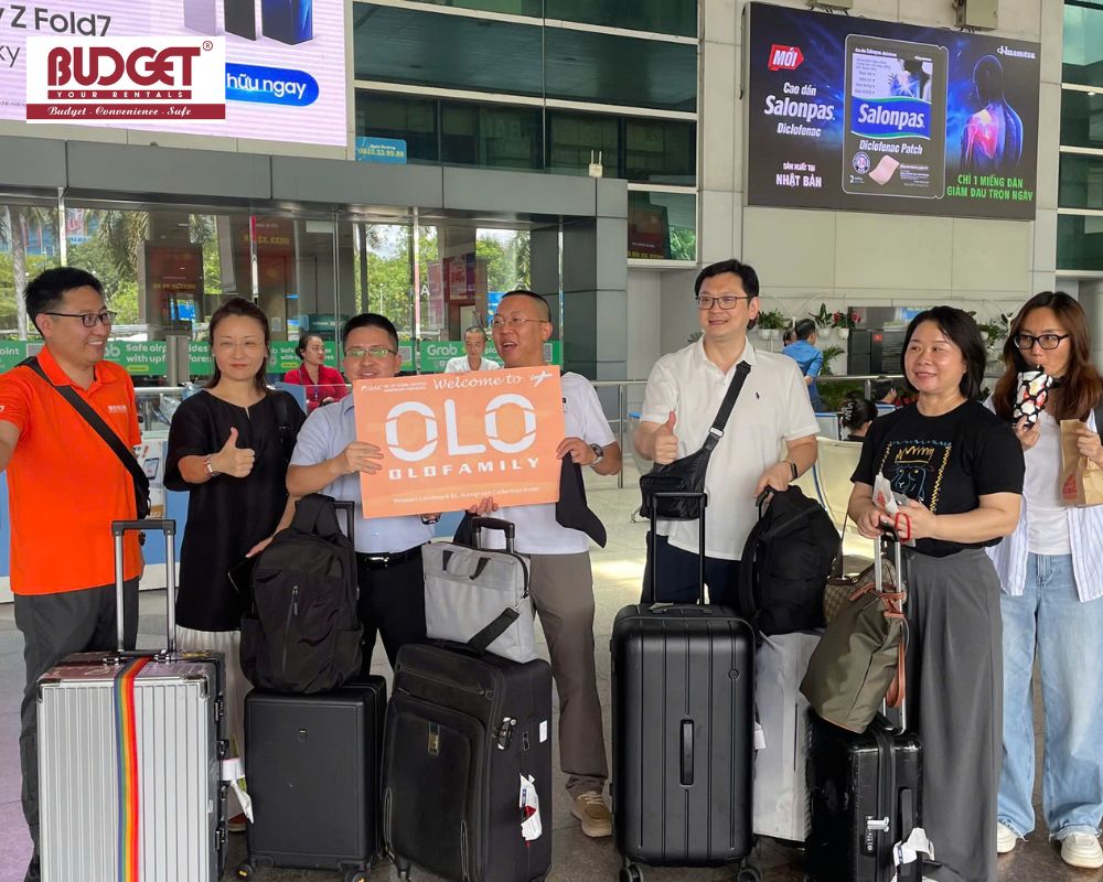 A-group-of-passengers-and-our-driver-posing-for-a-photo-at-Tan-Son-Nhat-Airport