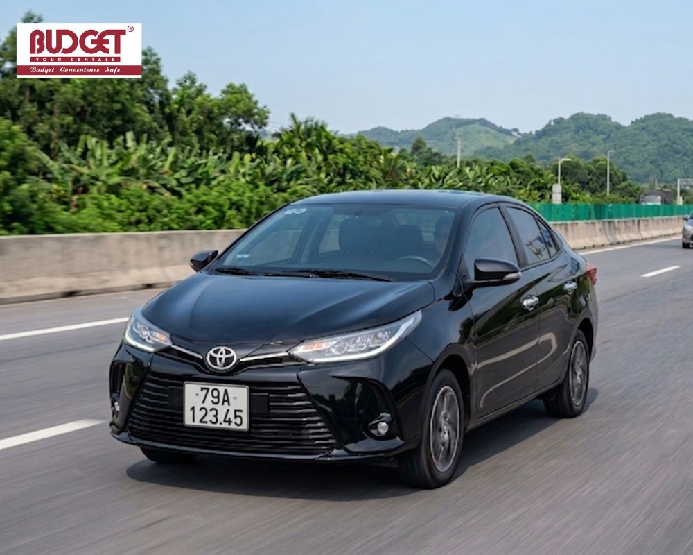 Black-Toyota-Vios-sedan-driving-on-the-expressway-from-Nha-Trang-to-Ho-Chi-Minh-City