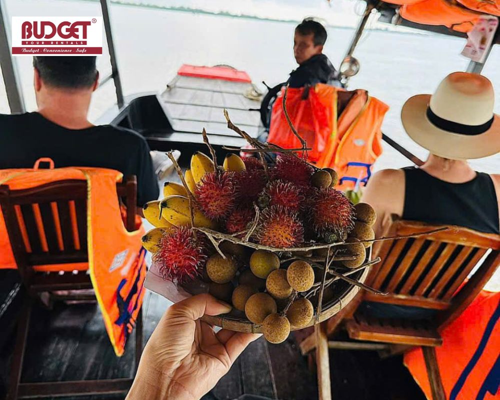 Close-up-of-a-woven-tray-overflowing-with-fresh-tropical-fruits-served-to-passengers-during-a-riverboat-cruise