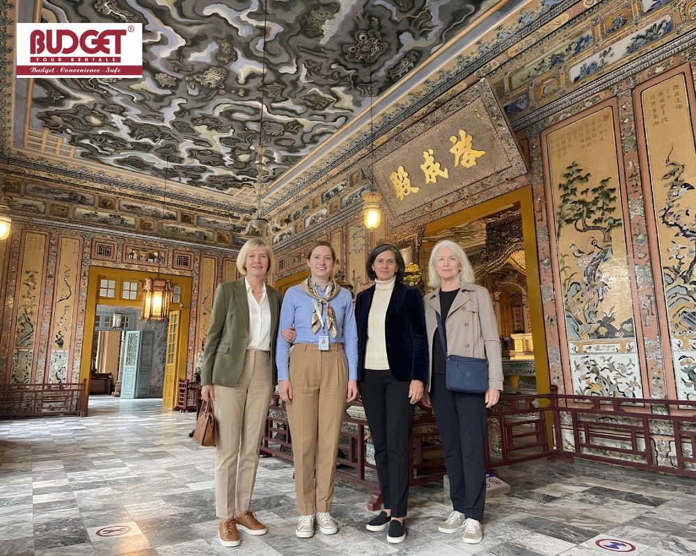 Four-female-travelers-took-a-photo-inside-the-ornate-interior-of-Khai-Dinh-Tomb-in-Hue