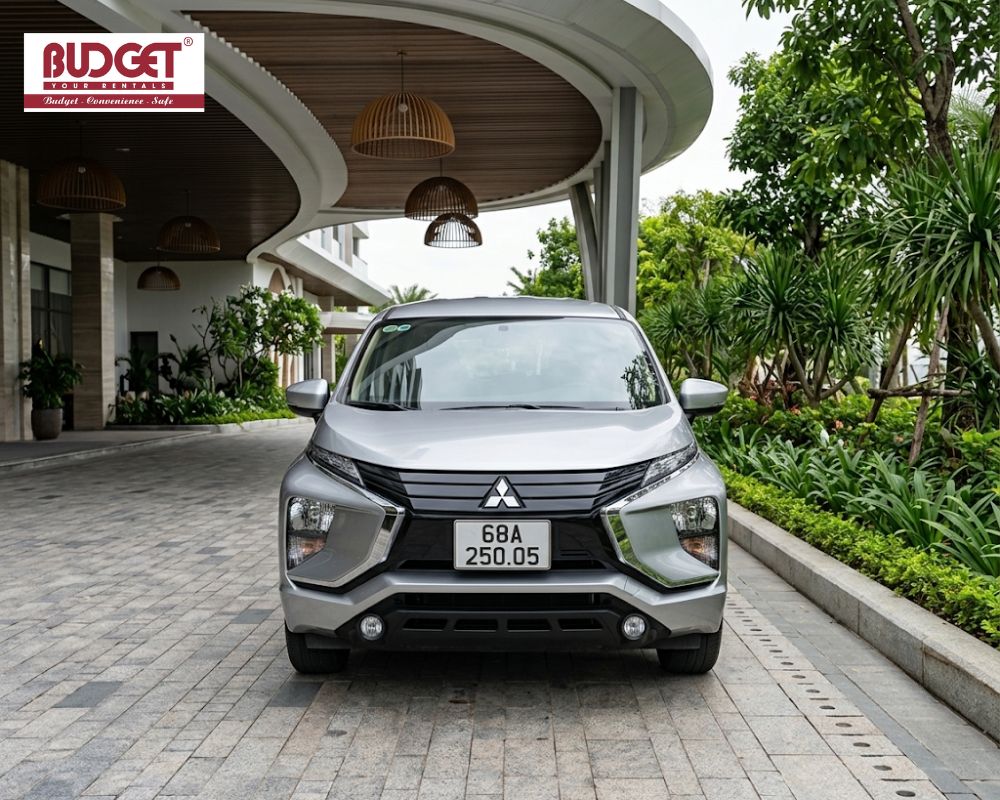 Front-view-of-a-silver-Mitsubishi-Xpander-MPV-parked-at-a-luxury-resort-entrance-in-Phu-Quoc
