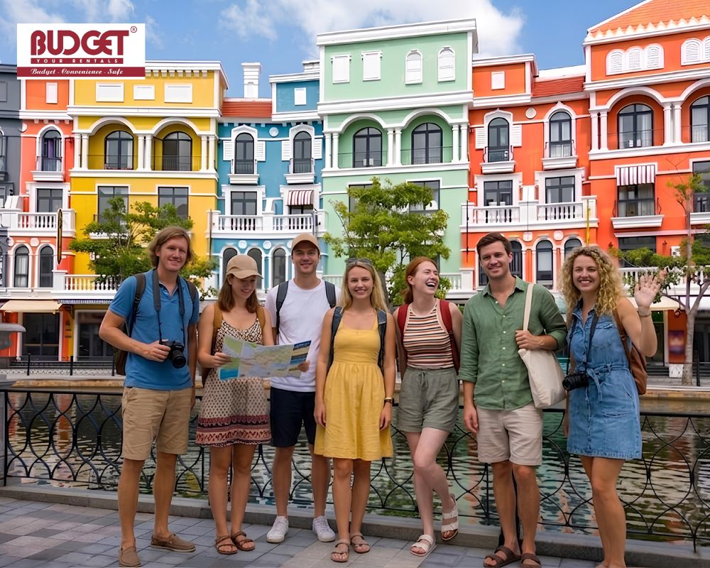 Group-of-happy-foreign-tourists-posing-by-the-canal-with-colorful-Venetian-style-architecture-at-Grand-World-Phu-Quoc