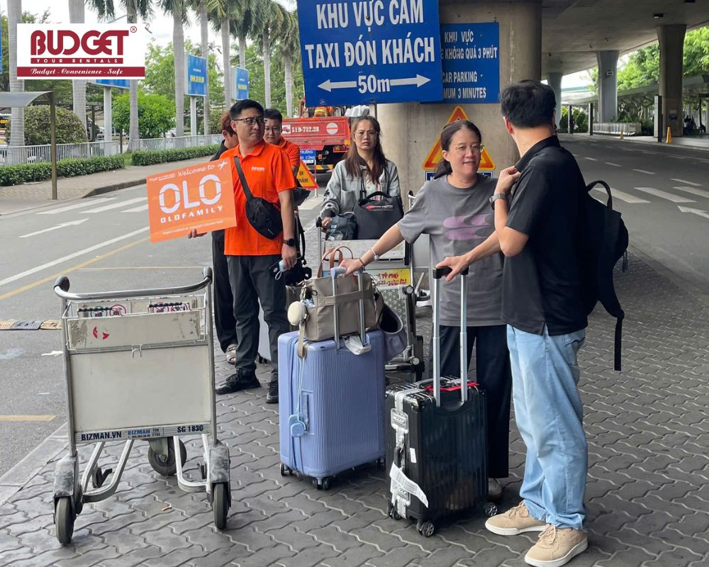 Our-driver-and-staff-welcoming-guests-at-Ho-Chi-Minh-airport-with-a-signboard