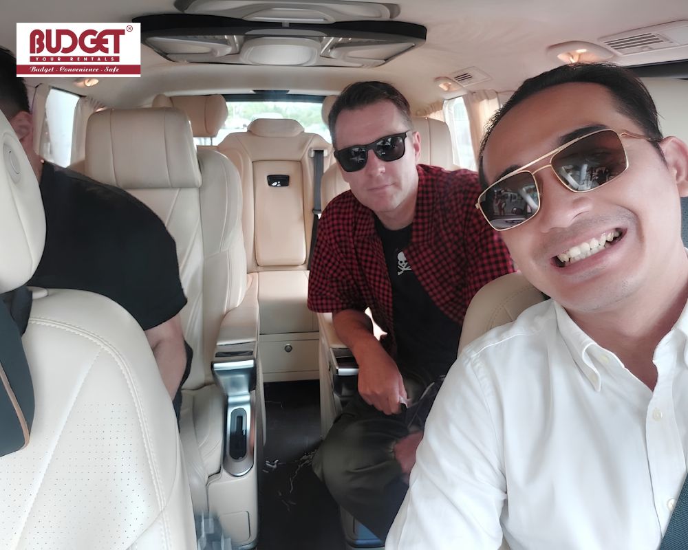 Our-driver-taking-a-selfie-with-passengers-inside-a-luxury-van-during-a-premium-Ho-Chi-Minh-car-rental