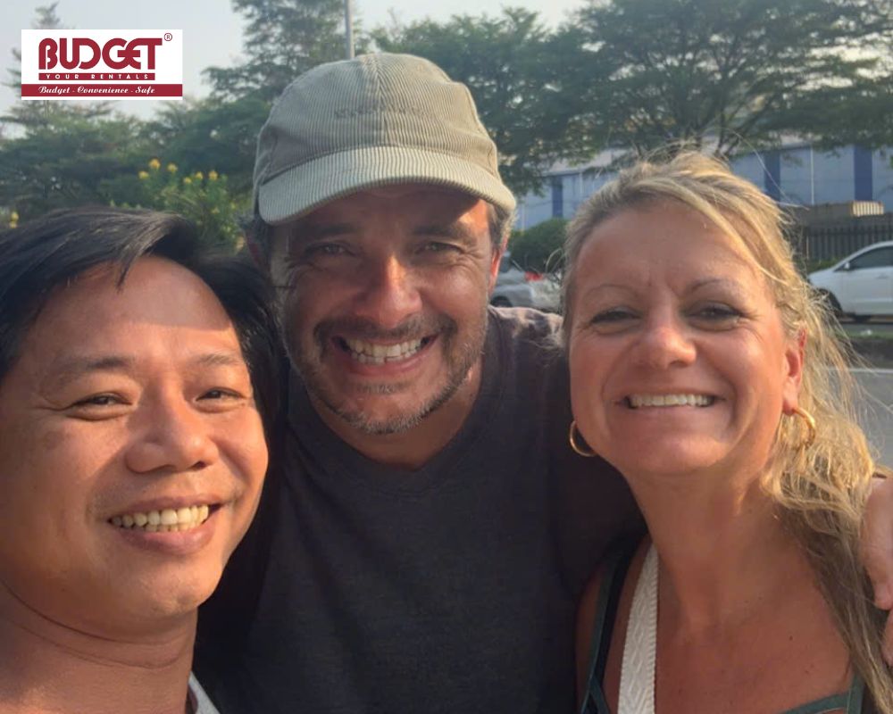 Our-private-driver-taking-a-selfie-with-a-tourist-couple-after-picking-them-up-at-Hiep-Phuoc-Port