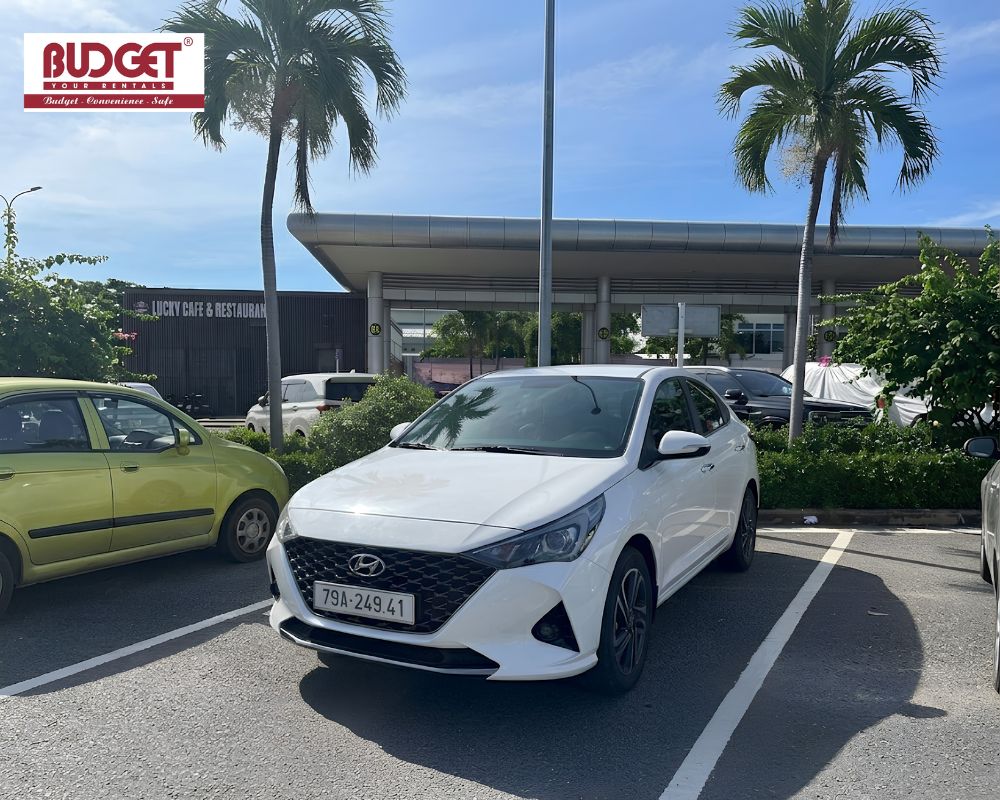 Our-rental-car-parked-in-the-lot-outside-Cam-Ranh-Port-near-the-Lucky-Cafe-Restaurant