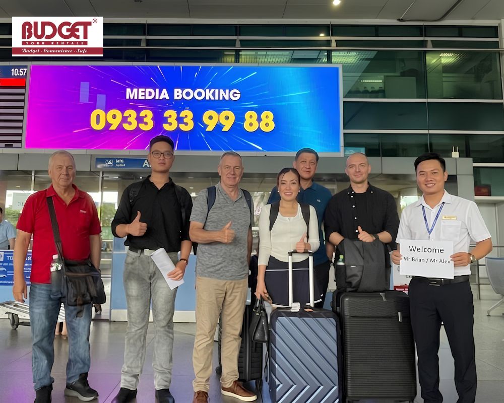 Our-tour-guide-and-driver-welcomed-international-guests-with-a-welcome-sign-at-Tan-Son-Nhat-airport-arrival-terminal