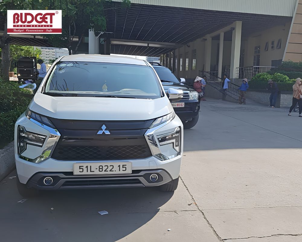 Our-white-Mitsubishi-MPV-parked-at-the-bustling-Moc-Bai-border-gate-terminal