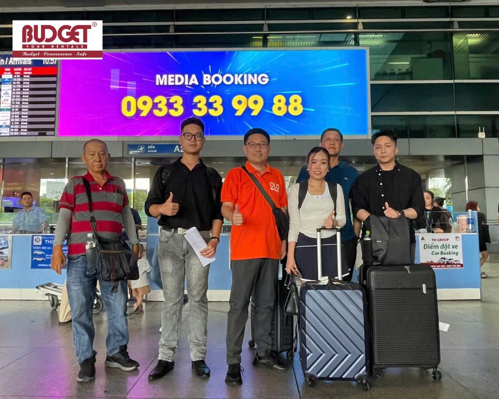 Passengers-and-our-driver-taking-a-photo-together-at-the-Tan-Son-Nhat-Airport-arrivals-hall